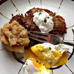 Potato Pancakes With Oven-Roasted Thyme Applesauce, Sour Cream, and Poached Eggs Recipe
