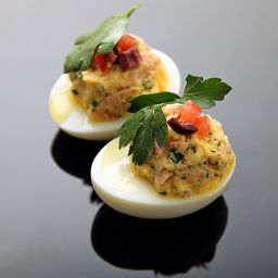 Deviled Eggs With Confit Tuna, Olives, Tomato, and Olive Oil Recipe